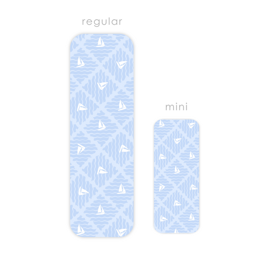 Two blue rectangular laminated bookmarks with white sailboat patterns, labeled 'regular' and 'mini'.