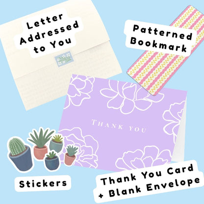 A collage of stationery items included in a mailing package, set against a light blue background. The items include a "Letter Addressed to You," a pink and yellow "Patterned Bookmark," a collection of succulent "Stickers," and a lavender "Thank You Card + Blank Envelope."