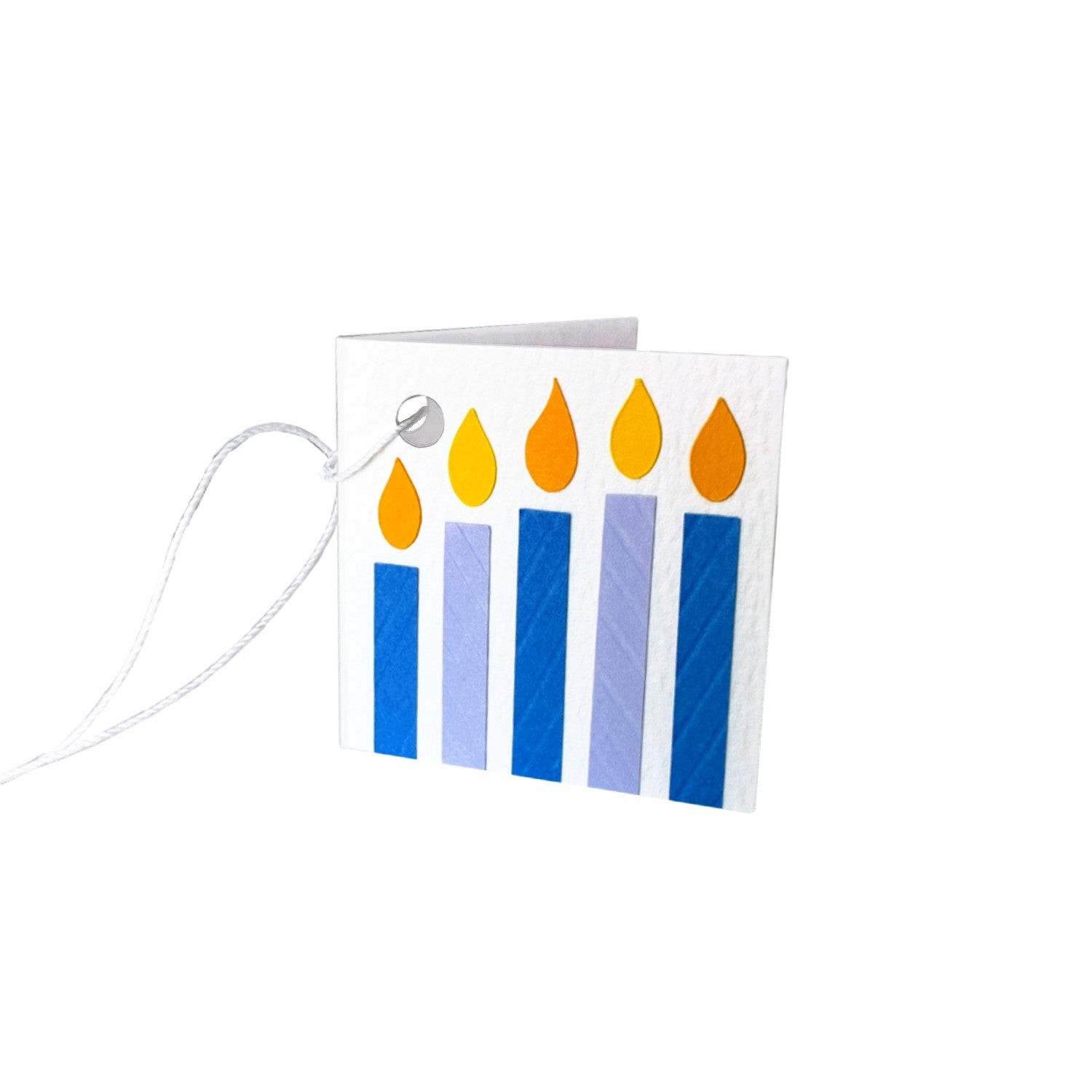 Paper gift tag with five paper candles in purple and blue, each topped with a yellow flame. The gift tag is attached by a white string.