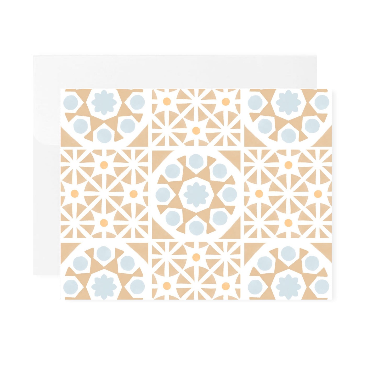 A horizontal greeting card featuring an all-over pattern of tan-colored Mediterranean tiles arranged in a symmetrical grid format. The folded card is shown laying flat with a white envelope tucked behind it. The card is centered against a plain white background.