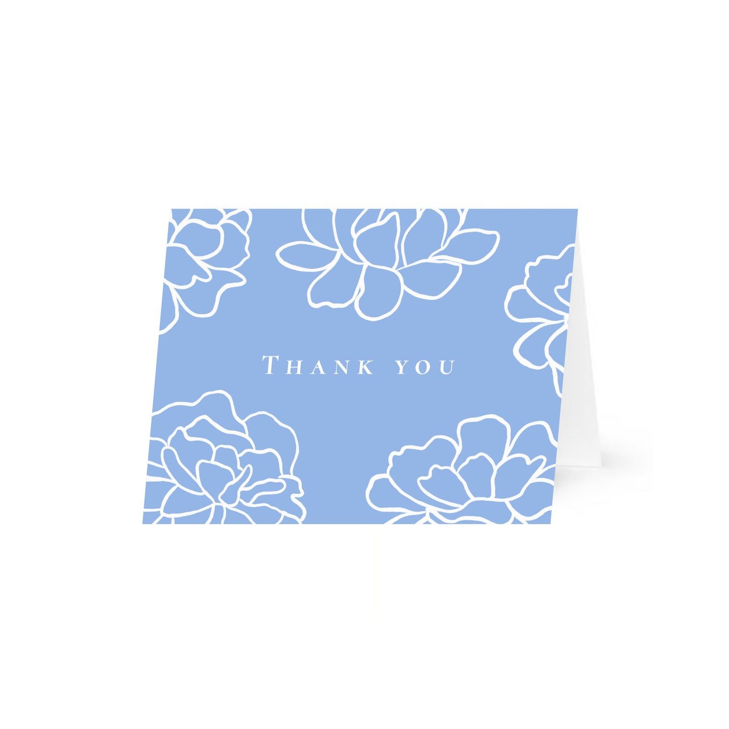 A light blue horizontal folded card standing up with white line-art peony flowers and the text "Thank you" in a central uppercase serif font. The card is centered on a white background.