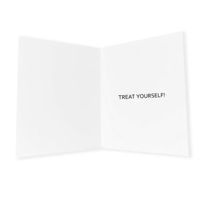 An open, white greeting card shown from the inside. the card is folded vertically across the middle, creating two equal white rectangular sections for writing messages. the background is a clean, neutral white. The message inside the card says "Treat Yourself!"