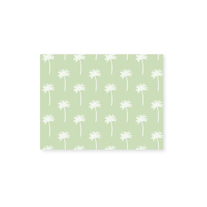 A horizontal notecard centered on a white background featuring a pattern of off-white palm tree silhouettes on a light green background.