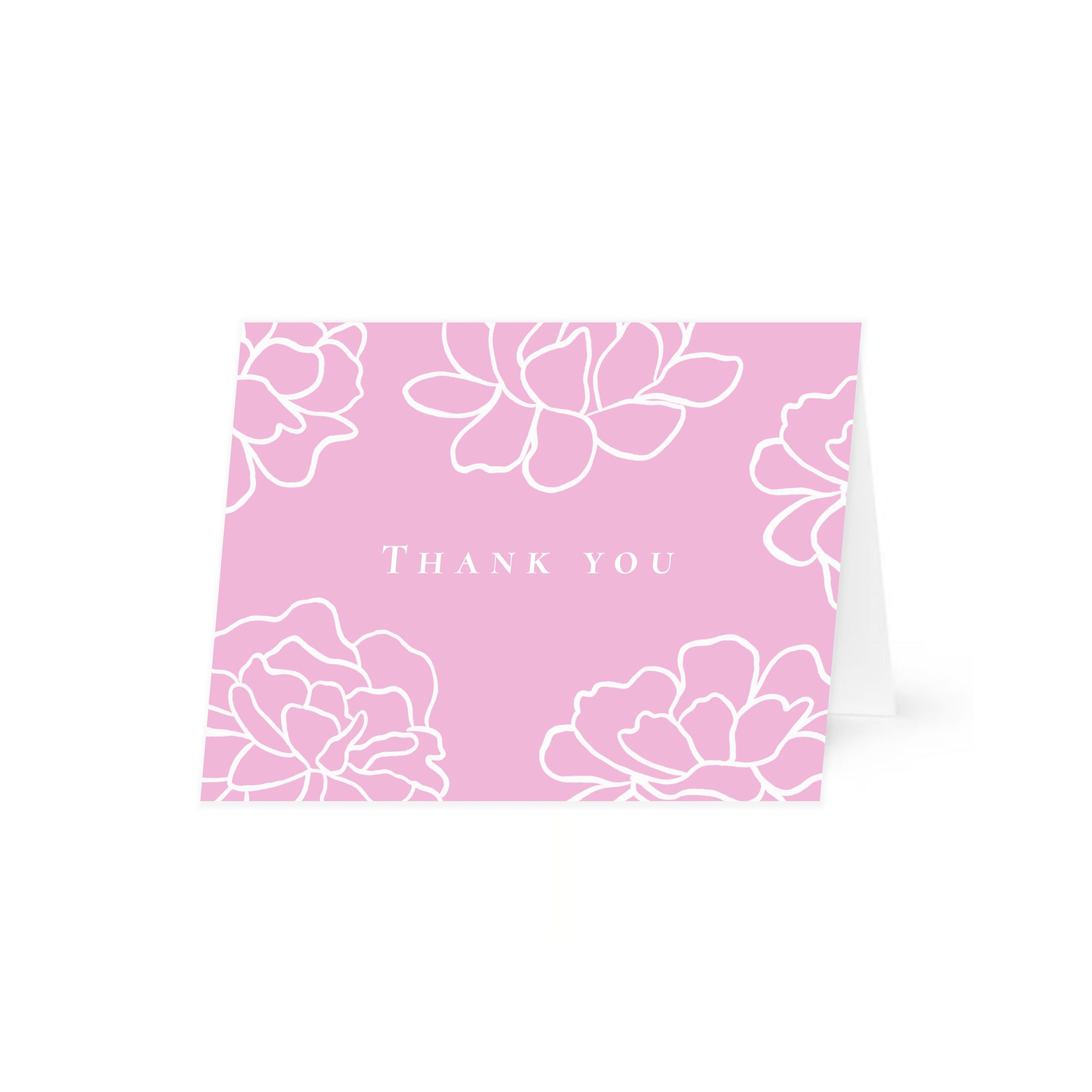 A pink horizontal folded card standing up with white line-art peony flowers and the text "Thank you" in a central uppercase serif font. The card is centered on a white background.